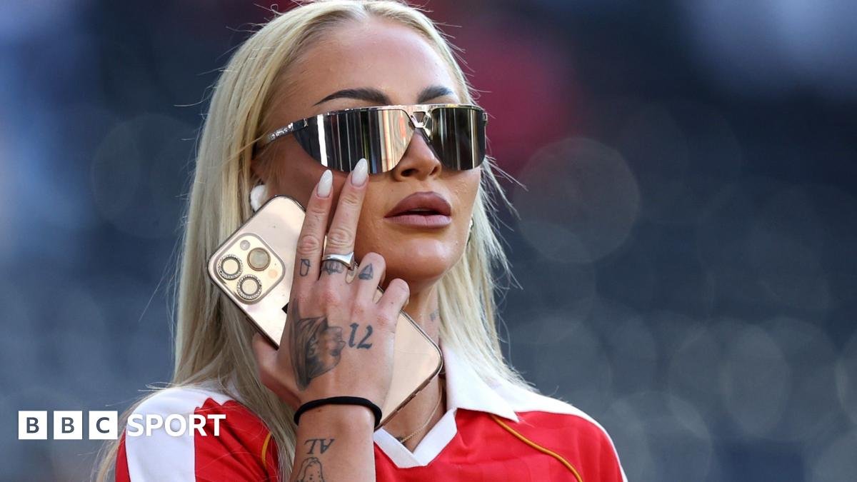 Alisha Lehmann in sunglasses and a red shirt