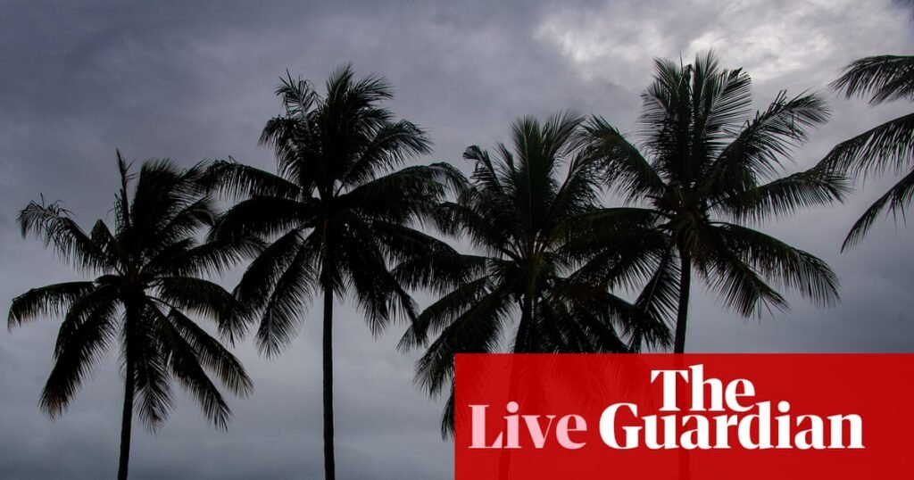 Australia news live: Queenslanders in path of Tropical Cyclone Narelle bunker down as wind gusts forecast to hit 250km/h | Australia news