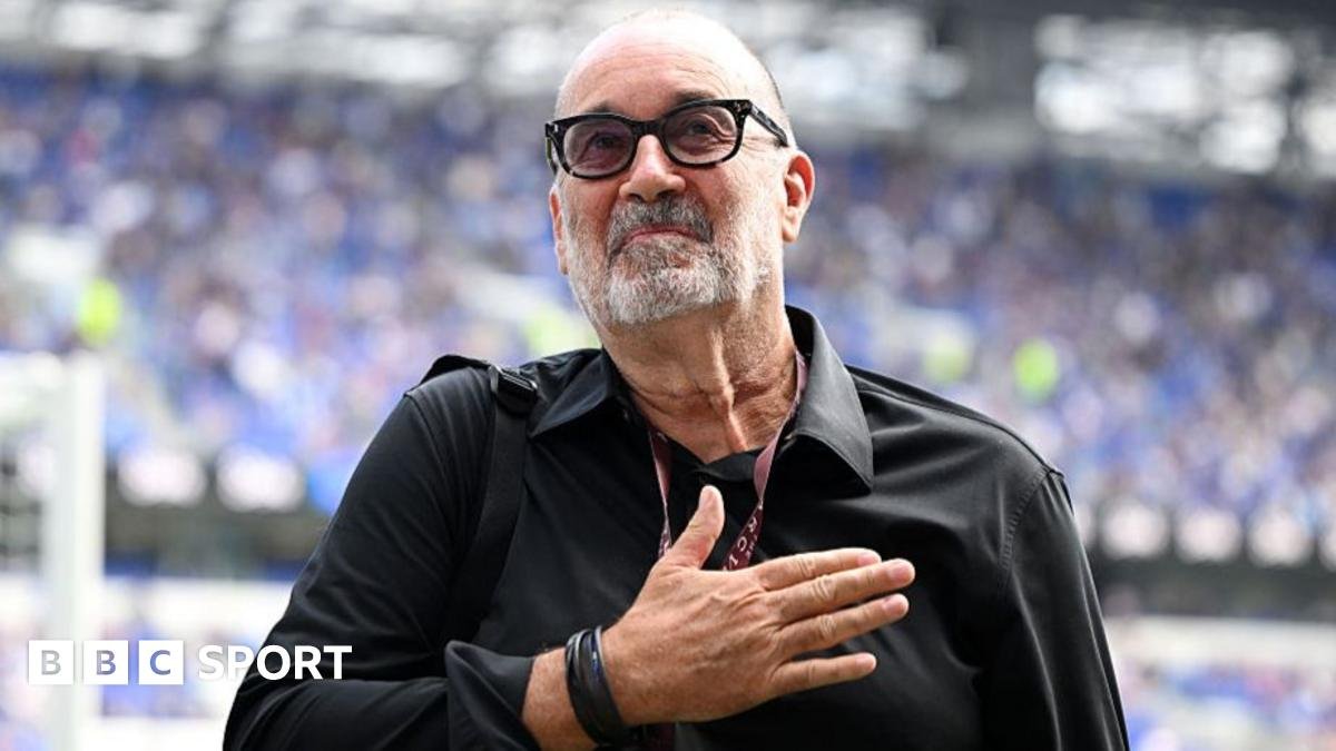 Designer Dan Meis applauds Everton fans at their first home match in their new stadium.