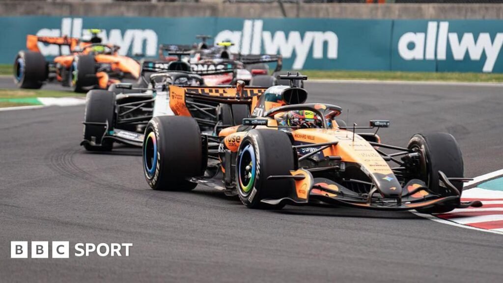 Oscar Piastri leads a trail of cars on track during the Japanese Grand Prix