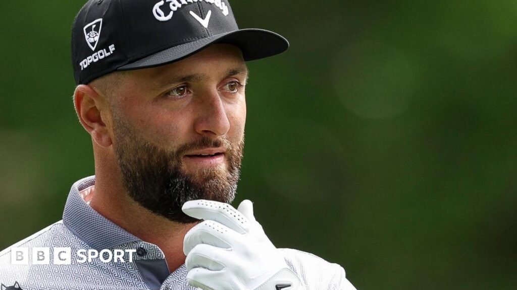 Jon Rahm with his hand on his chin