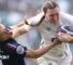England full-back Emma Sing hands off France's Joanna Grisez
