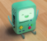 This is an image of BMO, the character from Adventure Time. He is a sage green 3D gameboy, with plus, triangle, and circle buttons on front in yellow, blue, and red respectively. His hands are held up in a cheering motion.
