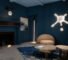 Modern living room with dark blue walls, abstract wall lights, a beige curved sofa, stone coffee tables, and a decorative rug. A basketball hoop light fixture hangs above the fireplace—a perfect Friday Five feature for design inspiration.