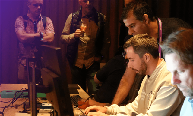 alt text for this image Developers explore AI and graphics workflows during a hands-on Arm Create event demonstration.