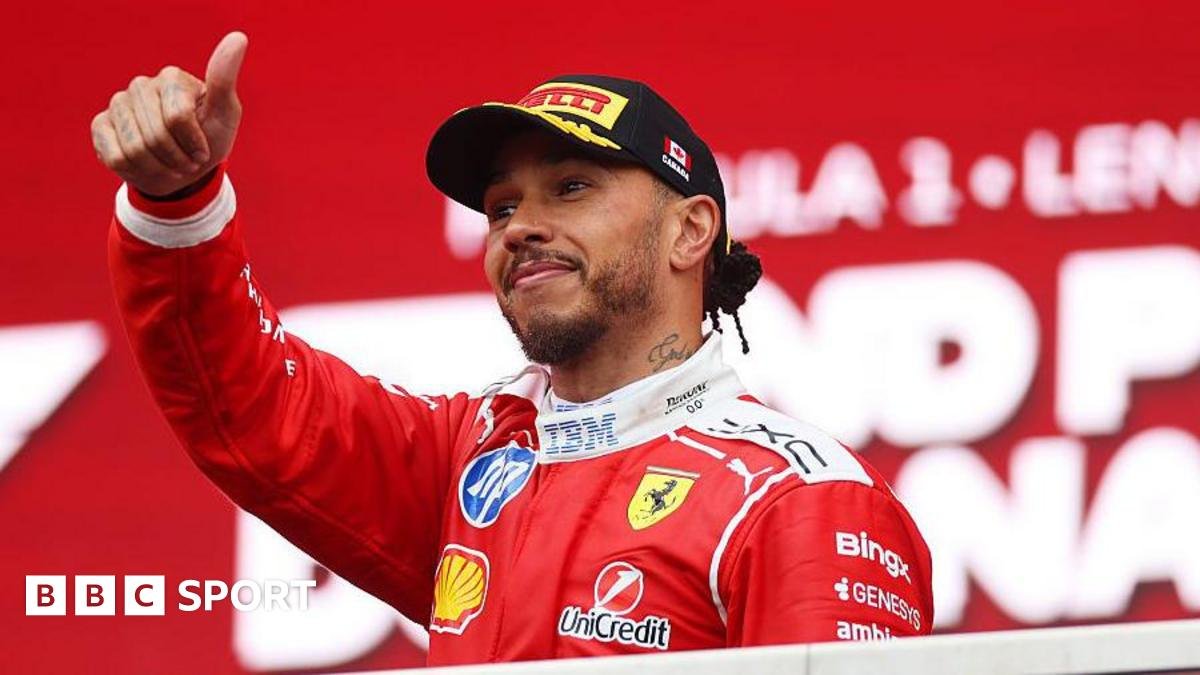 Lewis Hamilton gives a thumbs up on the podium in Canada
