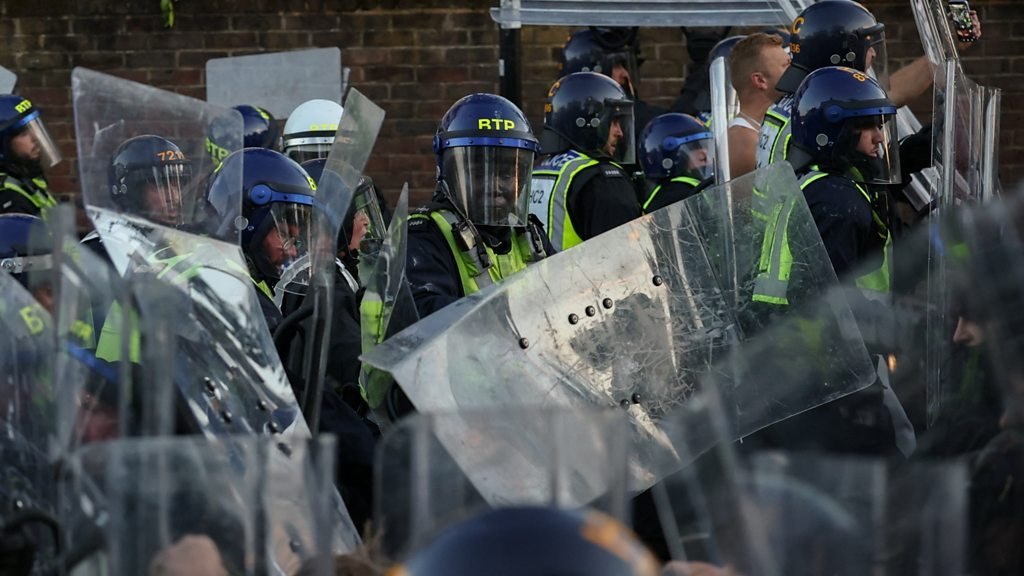 Protesters and riot police clash near home of Nowak's killer