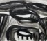 An abstract painting done with ink, with stark black gestural brushstrokes on a white canvas.