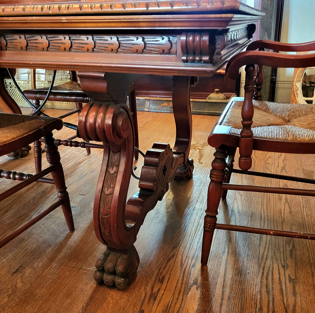 Antique table with hand-carved feet